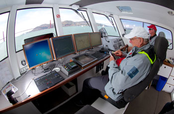 Aug 3 2013:  Harold Bennett and Alistair McRae on the bridge of Regardless. Photo Credit Steven Tsuchiya.